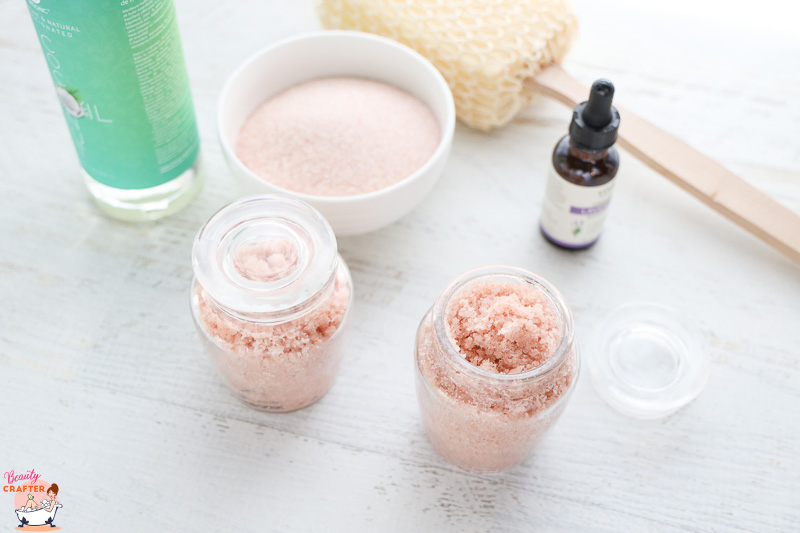 pink salt scrub in glass jars