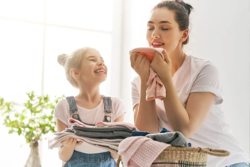 girls smelling fresh laundry