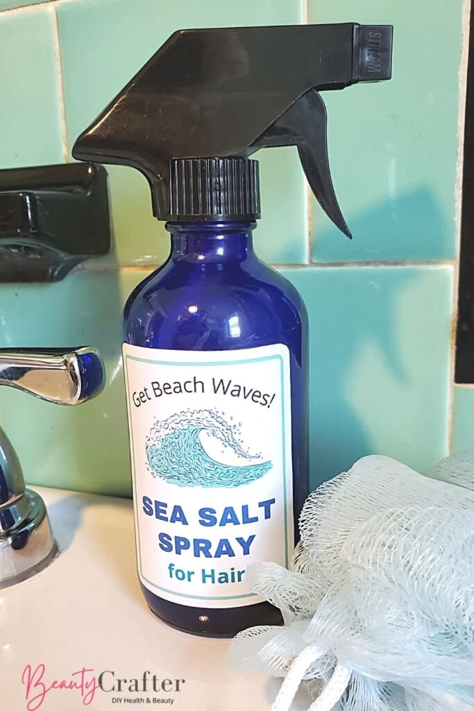 Sea salt spray for hair in glass bottle with printed label included with recipe.
