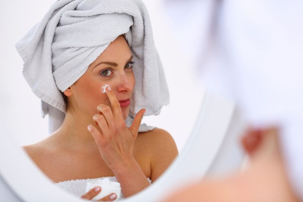 applying ceramides to skin in a a ceramide cream.